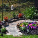 winding path bordered by flowers
